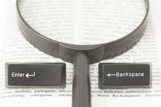 电脑键的输入和退格键以及书页上的镜头图片下载