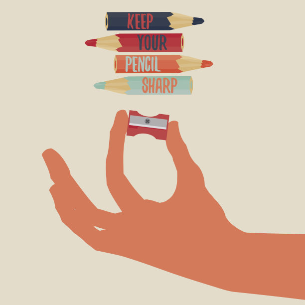 两根手指拿着红色的卷笔刀。保持你的铅笔锋利图片下载