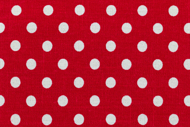 红色和白色圆点图案的布料照片图片下载