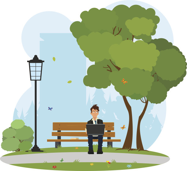 一个坐在公园里用笔记本电脑工作的人。图片下载