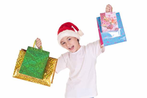 拿着圣诞包的男孩图片下载
