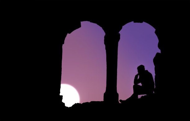 夕阳下坐着的男人的剪影图片下载