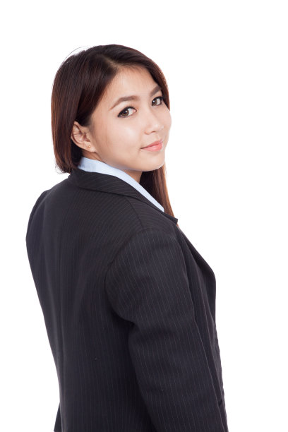 年轻的亚洲女商人回头看镜头图片下载