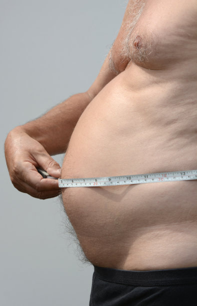 肥胖男性腹部轮廓用卷尺测量图片下载
