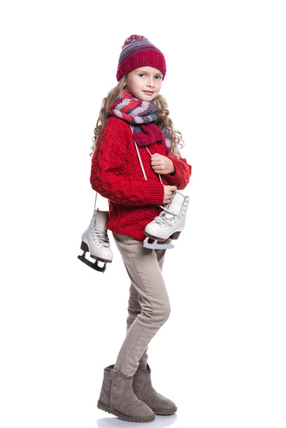 可爱的微笑小女孩，卷曲的发型，穿着冬装。图片下载