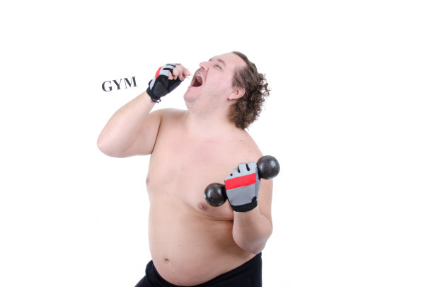 健身房里的胖子，有趣的锻炼。图片下载