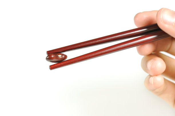 手捧红芸豆，用筷子隔图片下载