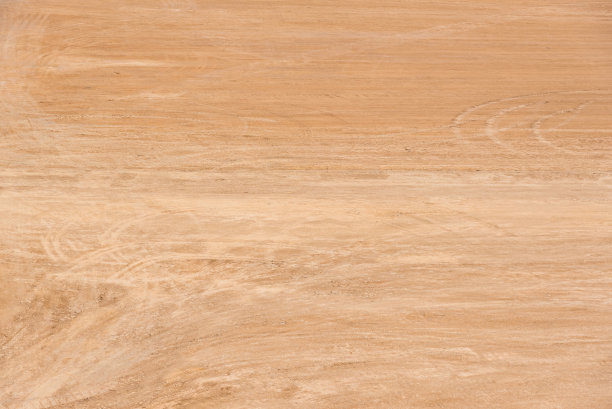 棕色的泥土空旷的土地背景与轮胎痕迹图片下载