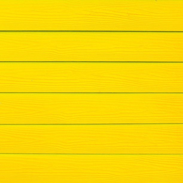 有划痕和脏污的木材被漆成黄色木板纹理背面图片下载