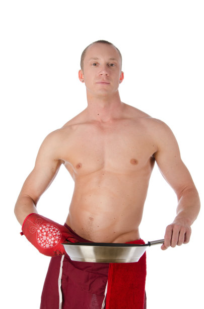 性感的厨师用煎锅。图片下载