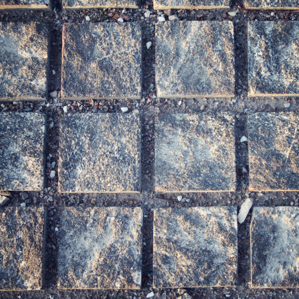 典型的路面。石头巷道。广场的模式。图片下载