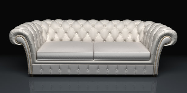 白色皮沙发孤立在黑色背景。图片下载