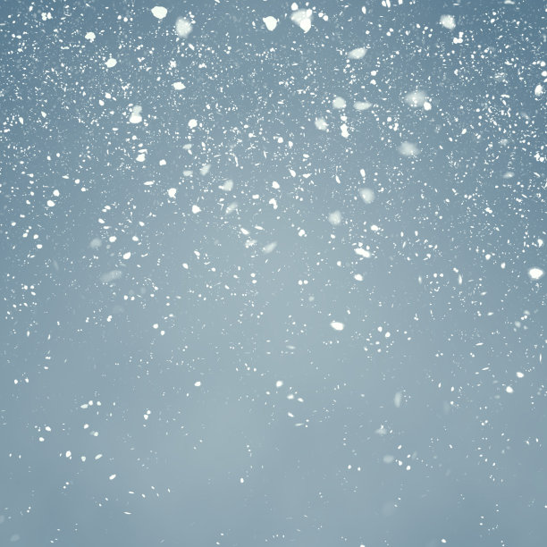 浅蓝色背景下的降雪素材图片