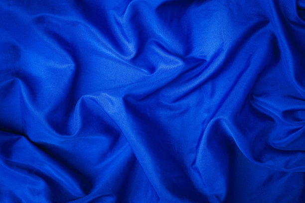 柔软的天鹅绒块蓝色织物素材图片