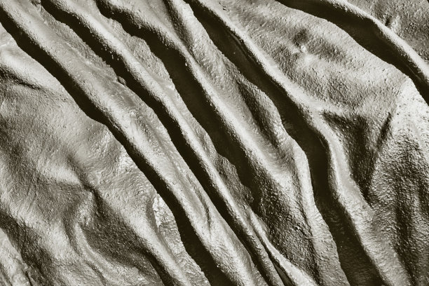 抽象的凹凸不平的石墨色纹理背景图片下载