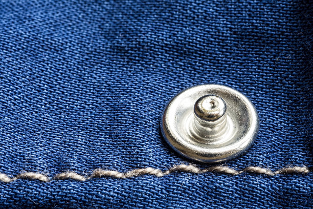 牛仔裤纹理与铆钉和线接近图片下载