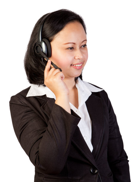 亚洲商务人员使用耳机和工作服图片下载