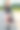 骑摩托车的年轻女子一边拿着摩托车头盔一边打电话图片下载