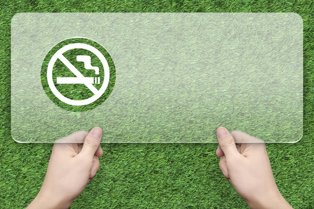 无烟信息框与绿草背景素材图片