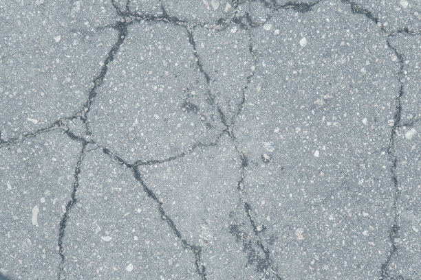 有裂缝和阴影的沥青。背景。图片下载