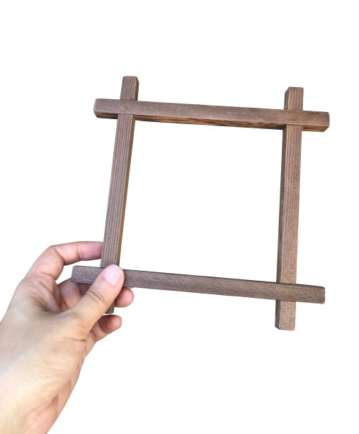 木制相框在手孤立图片下载