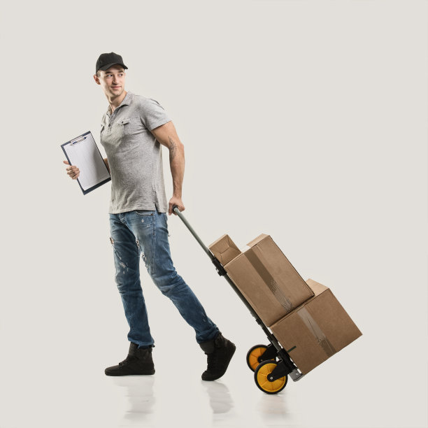 快递用手推车拉箱子和包裹图片下载