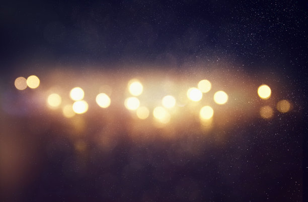 闪光灯光背景。金色和黑色图片下载