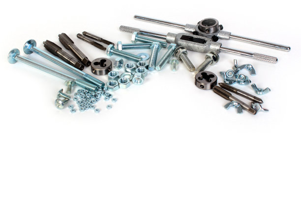 许多闪亮的螺栓螺母，丝锥和模具图片下载