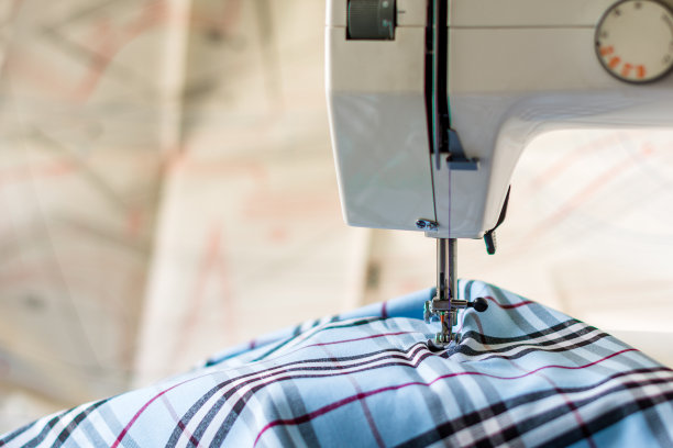 缝纫机与格子材料的背景与图纸图片下载