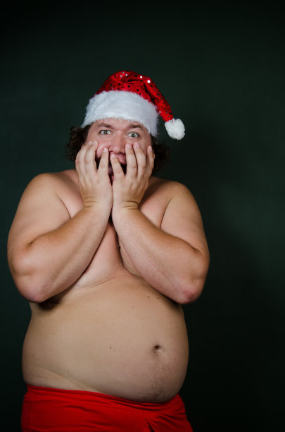 有趣的脂肪圣诞老人。图片下载