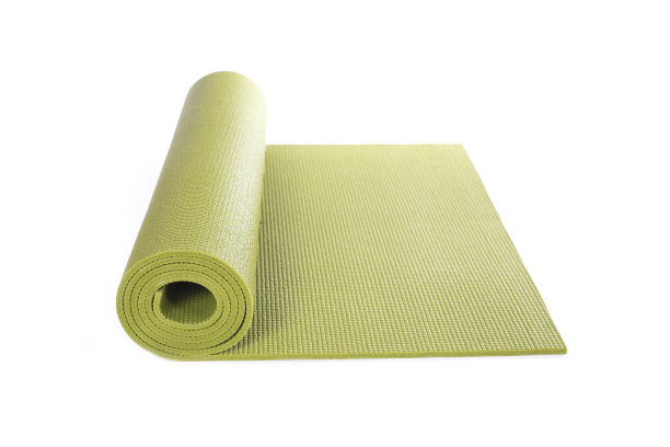 绿色瑜伽垫和白色的背景素材图片