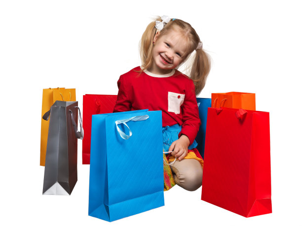 快乐的小女孩和许多五颜六色的购物袋图片下载