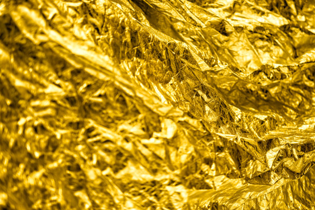 抽象的金色奢华grunge箔纹理背景。图片下载