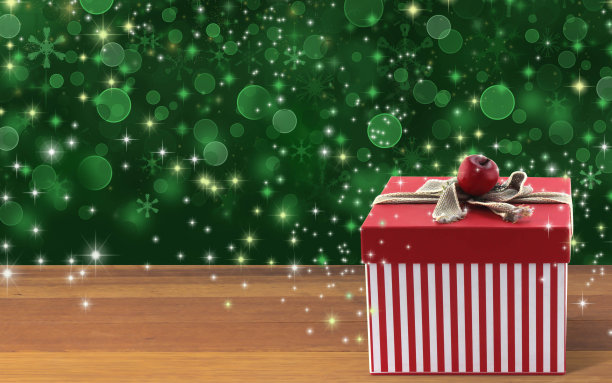 红色礼盒，木桌子，亮绿色背景素材图片