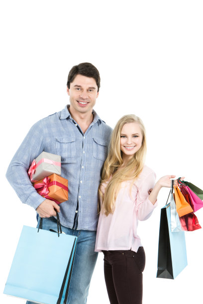快乐的情侣，带着礼物和购物袋。图片下载