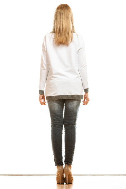 女人在牛仔裤高跟鞋后视图图片下载