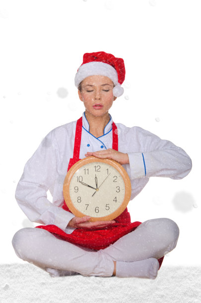戴着圣诞帽的厨师，雪下的瑜伽钟图片下载