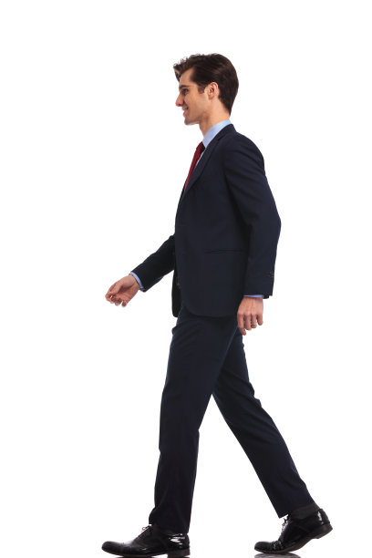 一个走路的年轻商人的侧视图图片下载