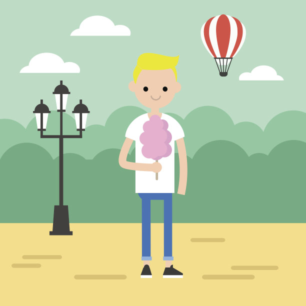 在公园里散步。金发男孩在吃棉花糖图片下载