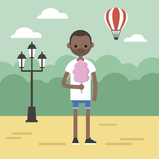 在公园里散步：黑人男子吃着棉花糖图片下载