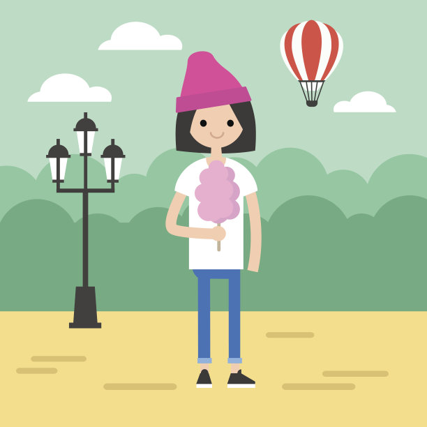 在公园里散步。小女孩在吃棉花糖图片下载