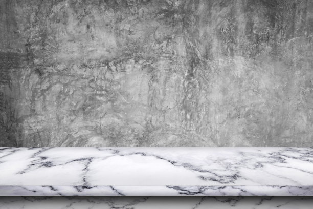 空荡荡的大理石桌面，裸露的混凝土背景。图片下载