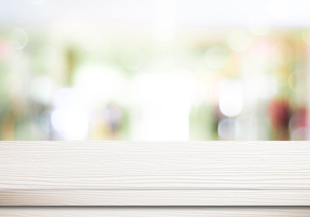 空白的白色桌子和模糊的商店散景背景图片下载