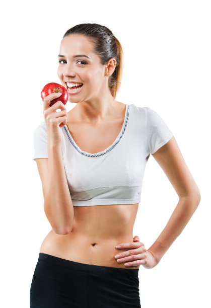 美丽健康的女人拿着一个苹果图片下载