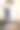 一个女人在试衣间里对着镜子试穿牛仔裤素材图片