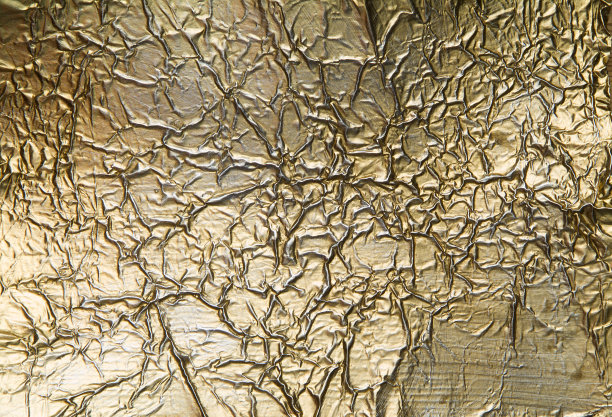皱巴巴的金色背景图片下载