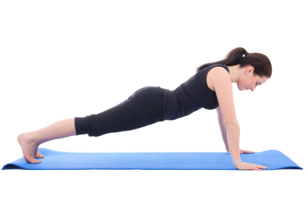 年轻女子做俯卧撑运动孤立在白色图片下载