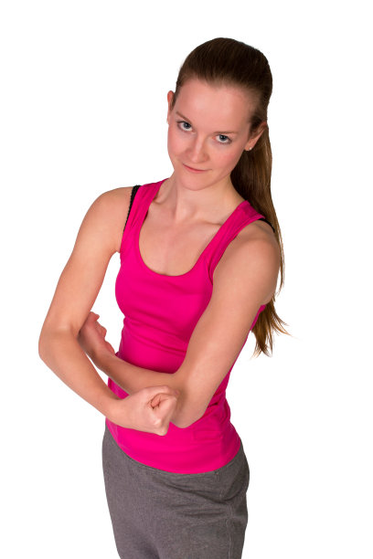 可爱的健身女孩弯曲的二头肌在白色图片下载
