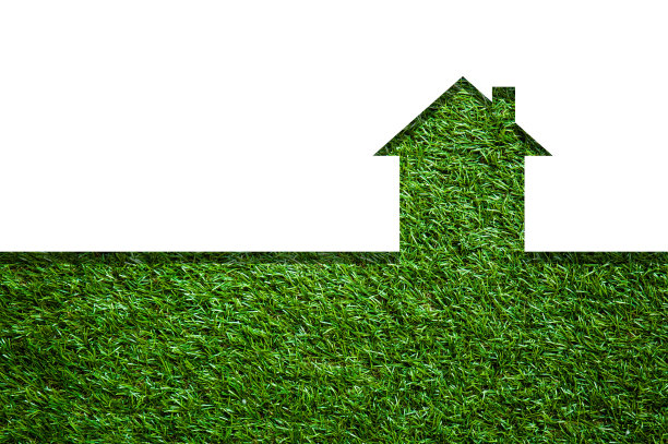 绿色田野上的房子的剪影素材图片