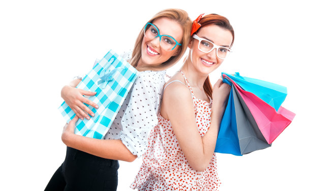 快乐的朋友，两个带购物袋的女孩图片下载